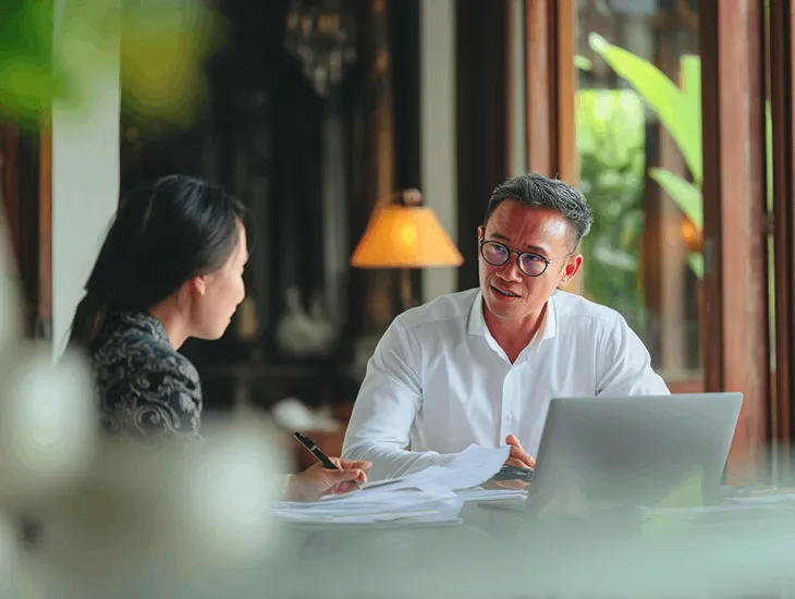 Danish entrepreneur in Indonesia collaborating with tax consultants to restructure PT PMA for Global Minimum Tax compliance and renewable energy incentives
