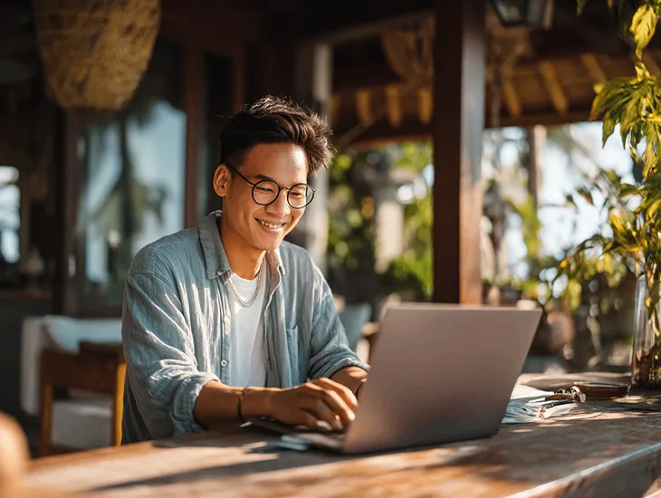Singaporean PT PMA owner in Bali reviewing tax correction documents with accountant to resolve DJP audit and file revised corporate tax return online
