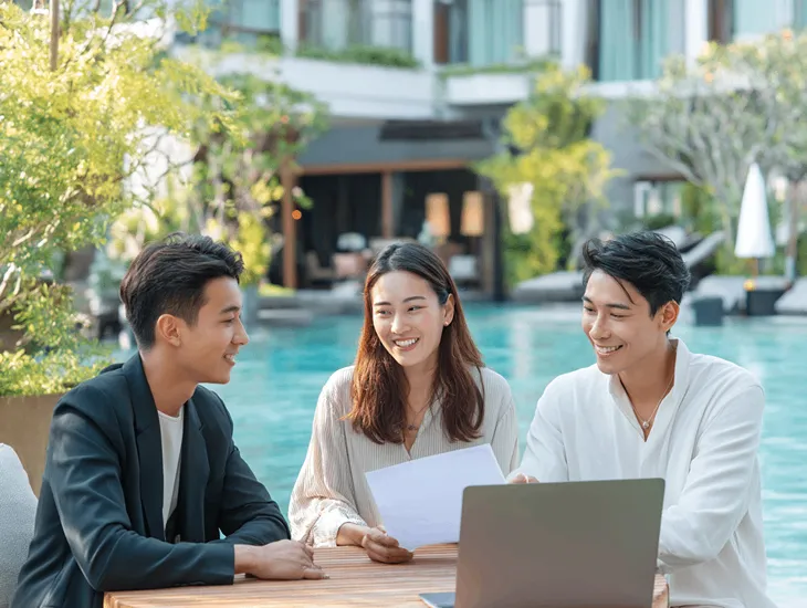 Accountant in Bali reviewing PT PMA VAT return on Coretax DJP, verifying tax invoice codes 02 and 03 for accurate compliance.