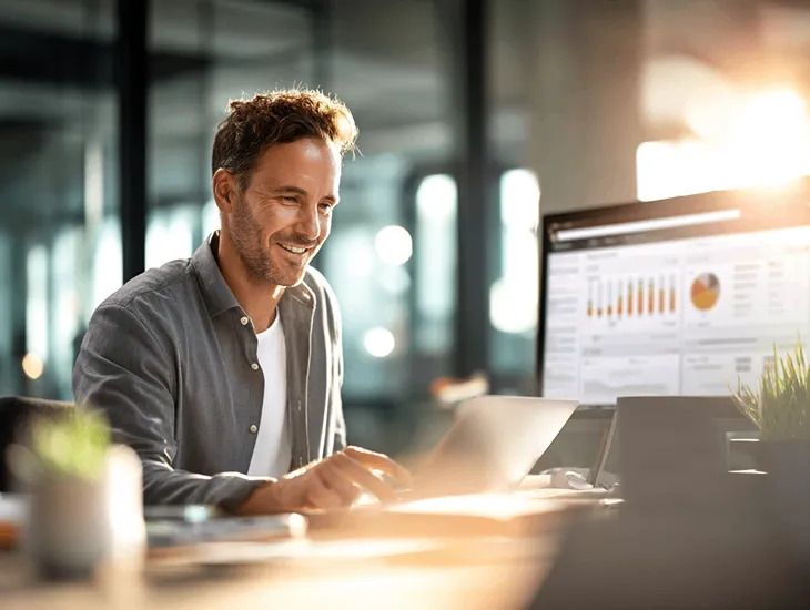 Foreign entrepreneur in Bali reviewing PT PMA tax documents and pajak.go.id dashboard to understand Indonesia’s 2025 penalty and reward system updates.