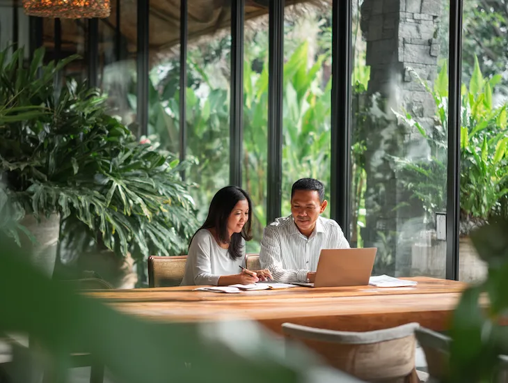 PT PMA business owners in Bali reviewing payroll tax compliance documents and NPWP records under Indonesia’s 2026 rules