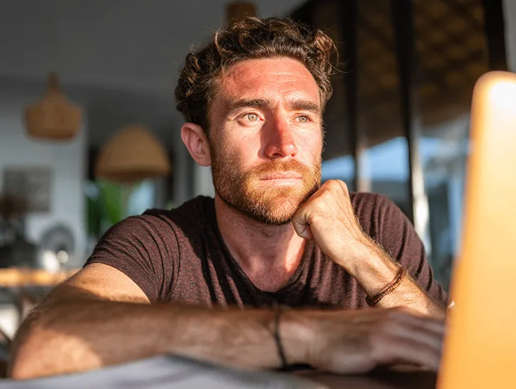 PT PMA owner in Bali reviewing online seller tax reports with VAT and legal documents on Coretax DJP Online