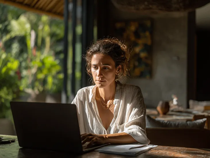 Foreign PT PMA owner in Bali checking PER-11/PJ/2025 tax invoice validation and Coretax DJP Online compliance with legal documents