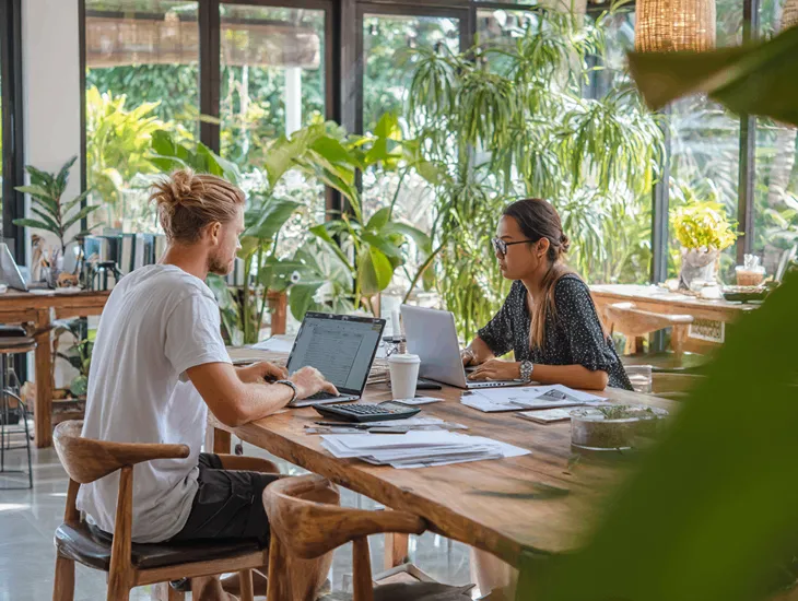 PT PMA owner in Bali preparing NPWP registration documents and uploading verified files to Coretax DJP Online under PER-7/PJ/2025 compliance