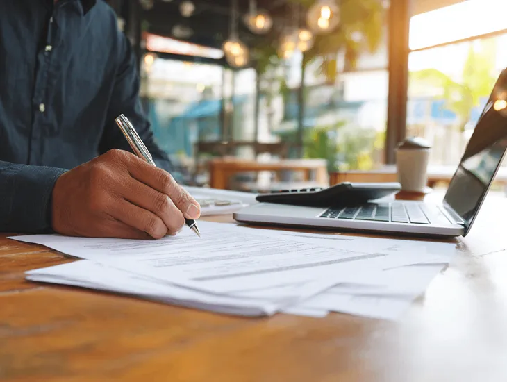 PT PMA accountant in Bali preparing financial statements and uploading Annual Income Tax Return documents through Coretax DJP Online system