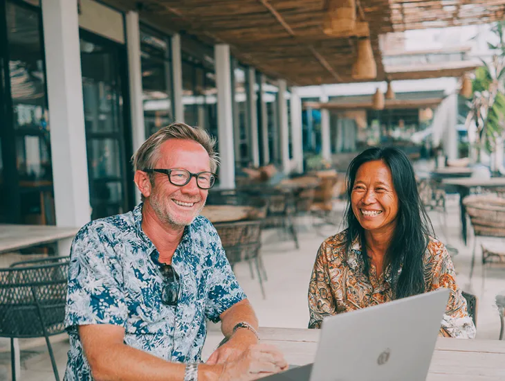 PT PMA tax consultant in Bali assisting a foreign entrepreneur with PKP revocation documents and verifying compliance status through Coretax DJP Online under PER-7/PJ/2025