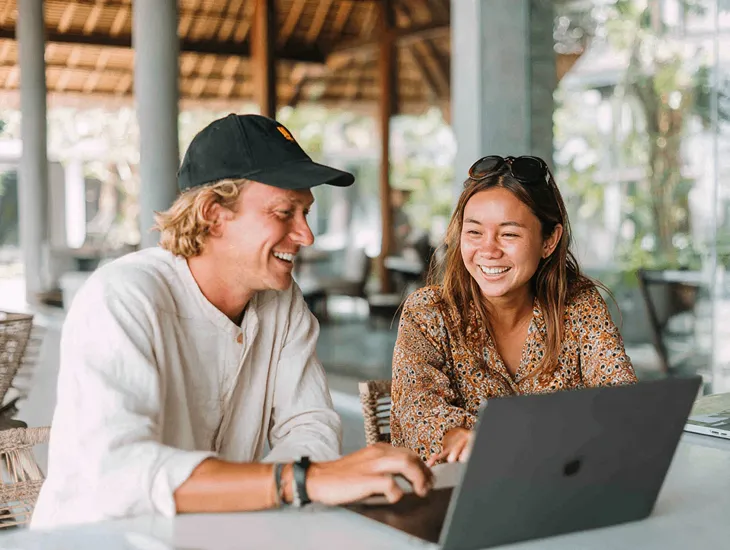 Foreign PT PMA owner in Bali reviewing tax filings on Coretax DJP Online with accountant to ensure compliance with Directorate General of Taxes and KUP Law regulations