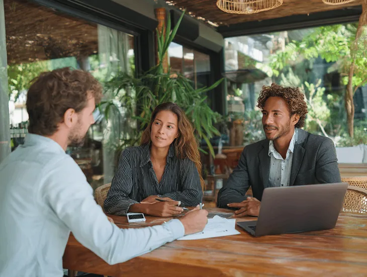 Foreign PT PMA owner in Bali reviewing PER-6/PJ/2025 regulation to qualify as Low-Risk PKP through Coretax DJP Online and maintain VAT compliance