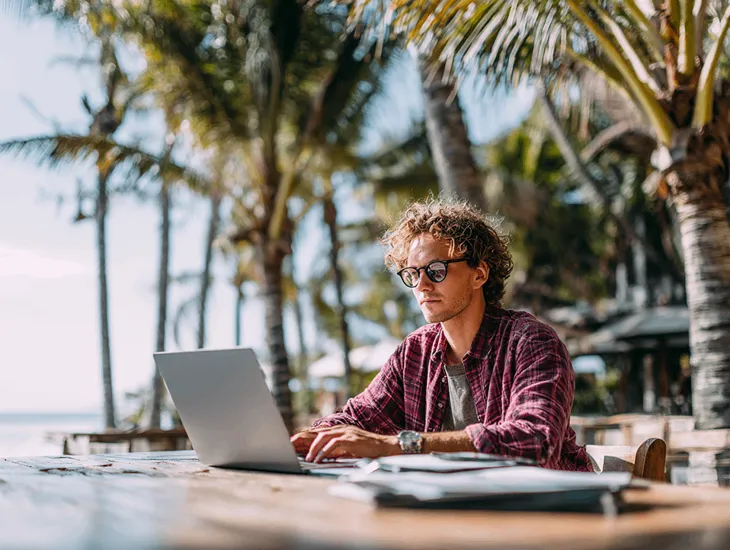 Foreign PT PMA owner in Bali submitting annual SPT tax return through Indonesia’s Coretax DJP Online system under PER-11/PJ/2025 regulation